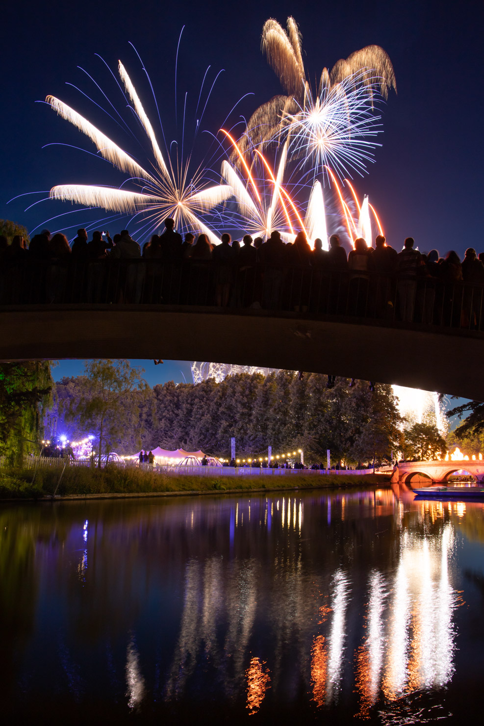 Trinity May Ball fireworks are one of the best sights of May week. I managed to get a spot low down by the Trinity Hall punts so I could capture the crowd of people packed onto Garrett Hostel Bridge to watch the show.